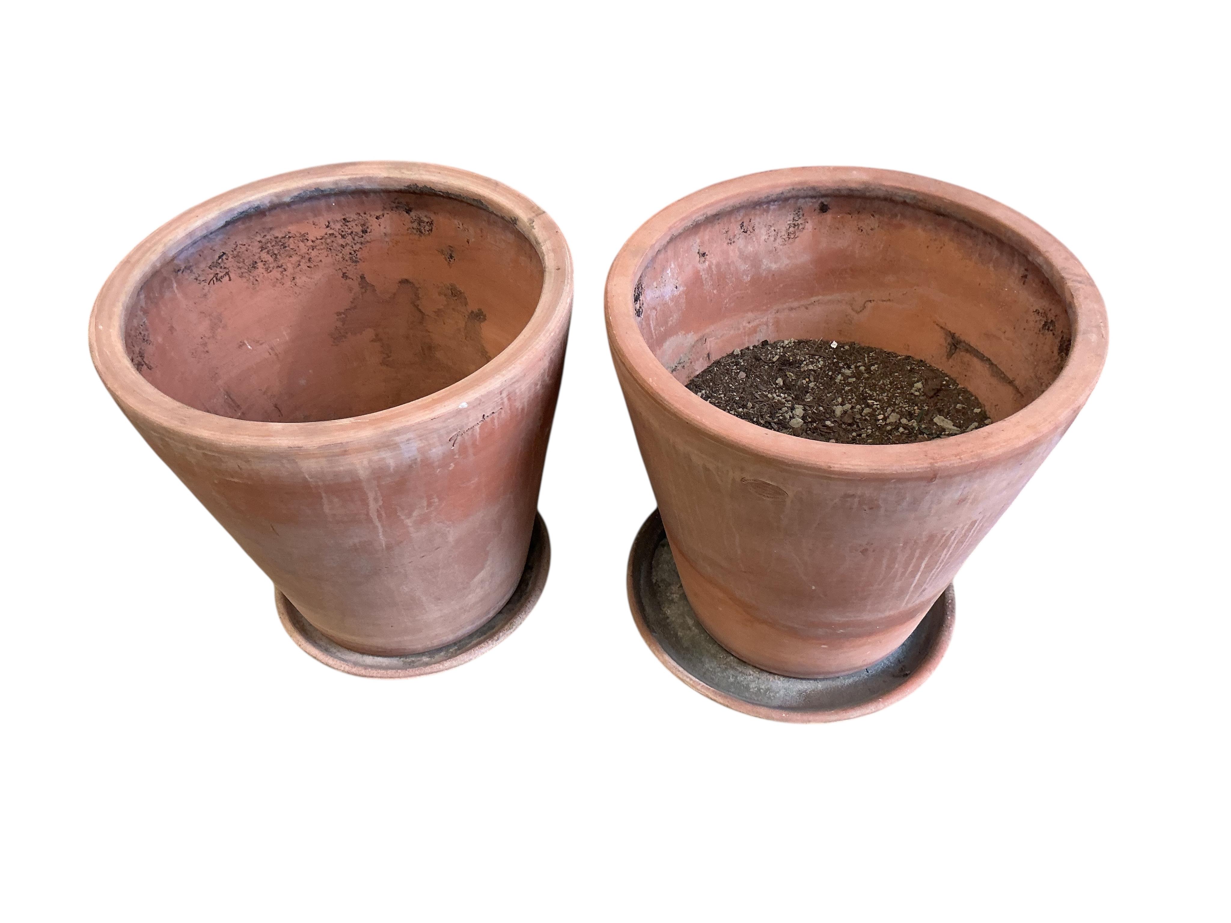 A pair of Goicoechea circular pottery planters with tray bases, diameter 54cm, height 53cm